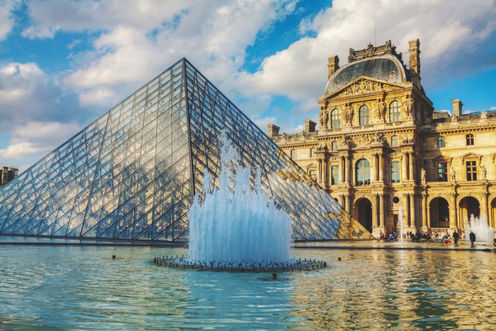 Paris, France - October 9, 2014 The Louvre Pyramid in Paris, France. It serves as the main entrance to the Louvre Museum. Completed in 1989 it has become a landmark of Paris.;high res